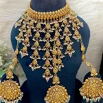 RO19552 Beautiful Premium Quality Matt Gold Polish Water Drop Necklace With Beautiful Earrings And Tika?